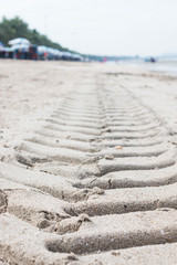 Fototapeta na wymiar Tyre track in the sand 