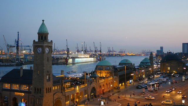 Landungsbruecken and the harbor at night in Hamburg, Germany