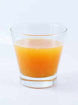 Fresh Orange juice with sliced fruit on white background
