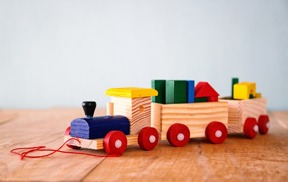 Wooden toy train over wooden floor. selective focus
