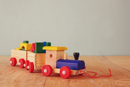 Wooden toy train over wooden floor. selective focus
