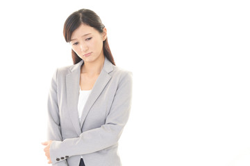 憂鬱な表情のビジネスウーマン