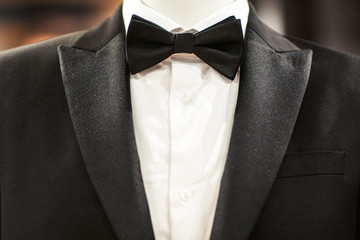  Black tuxedo and tie on mannequin - obrazy, fototapety, plakaty