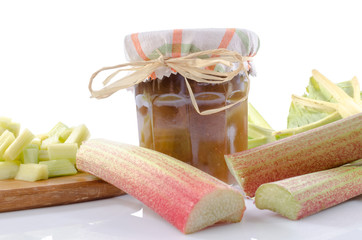 Rhubarb jam jar with fresh rhubarb
