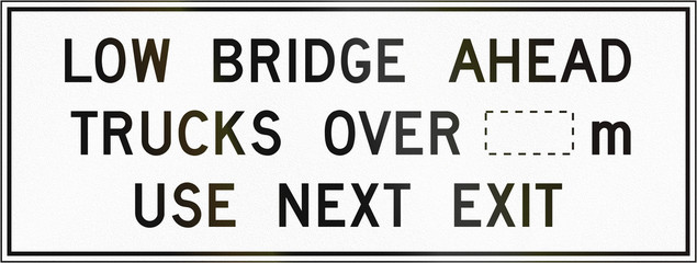 Roadworks sign in Canada - Low bridge ahead, Trucks over... m use next exit. This sign is used in Ontario