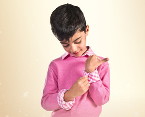 Portratit of young boy with pink sweater