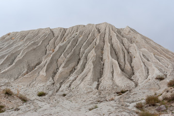 Mountain made from macadam and sand in open-pit mining for rock