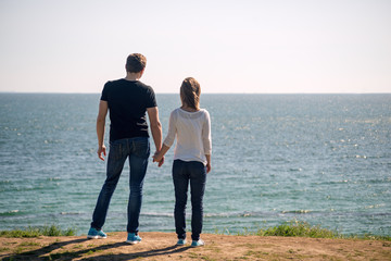 Young couple standing on a beach