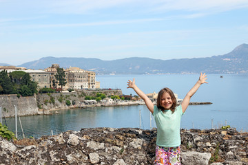 happy little girl on summer vacation in Corfu town Greece