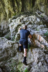 Man climbing on rocky mountain