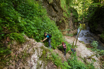 Hikers climbing on a safety cable