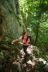 Naklejka na ściany i meble Backpacker lady on forest trail