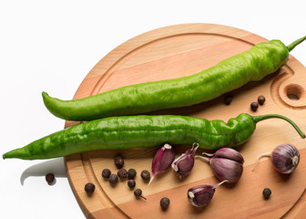 pods of green pepper and garlic cloves