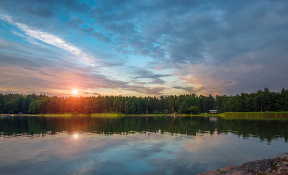 the sky beautiful sunset on the lake, Finland © dikana87