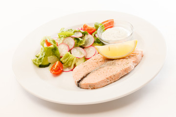 salmon steak with salad