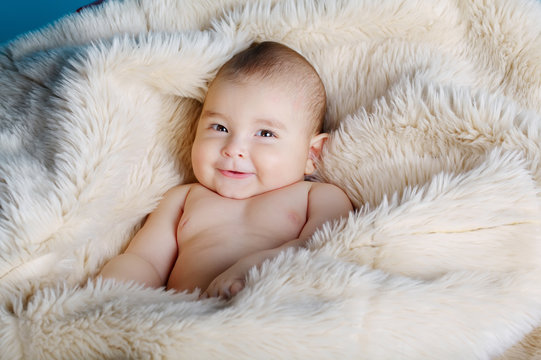 cute baby portrait lying on fur
