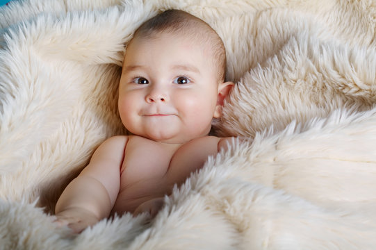 cute baby portrait lying on fur