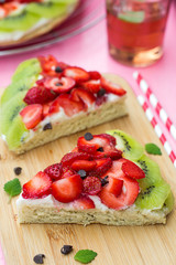 Sponge cake with strawberries and kiwi in shape of watermelon
