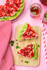 Sponge cake with strawberries and kiwi in shape of watermelon