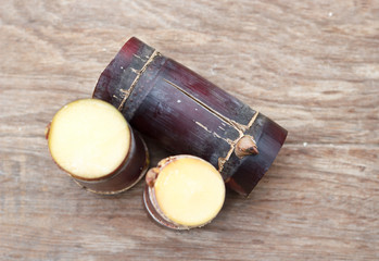 Close up Sugar cane on wood background.