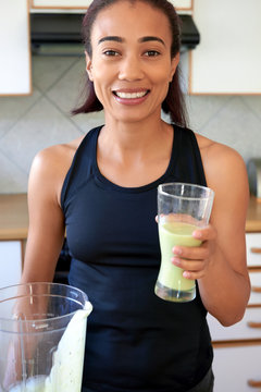 woman holding a smoothie glass