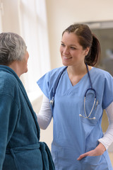 Doctor smiling at senior patient