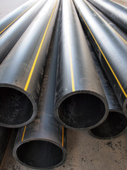 Plastic pipes of large diameter black closeup