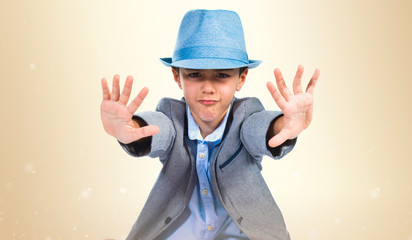 Child making stop sign