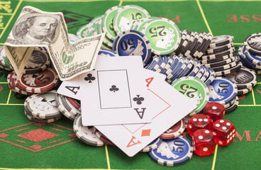 Poker chips, money,playing cards and dice