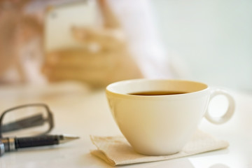 Vintage and pastel color tone style of coffee cup with businessman