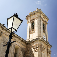 Fototapeta na wymiar Rotunda of Mosta church, Malta. Detail of one of the towers outside the Rotunda of St Marija Assunta, a key landmark in the town of Mosta, Malta.
