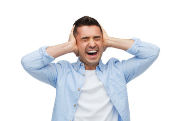 unhappy man with closed eyes touching his forehead
