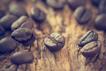 vintage color tone, coffee beans on the old wooden