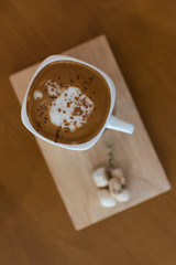 hot coffee on a wooden tray