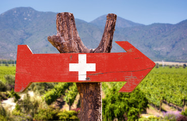 Switzerland Flag wooden sign with winery background