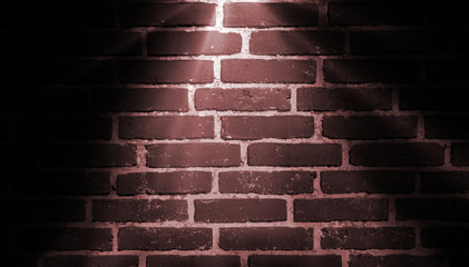 spot light red on brick wall