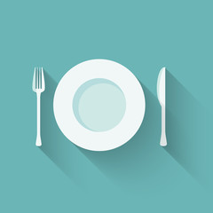 Plates and cutlery with long shadows