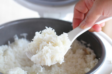 scoop streamed rice by Thai master chef's hand