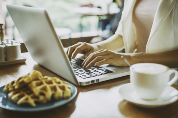 woman doing work in a coffee shop  