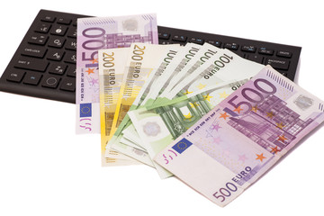 Euro banknotes on keyboard