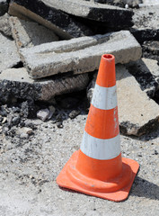 Traffic cone red stripes around the excavation