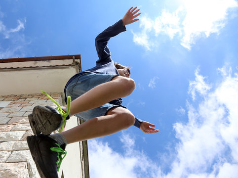 jump of a child and the blue sky in summer
