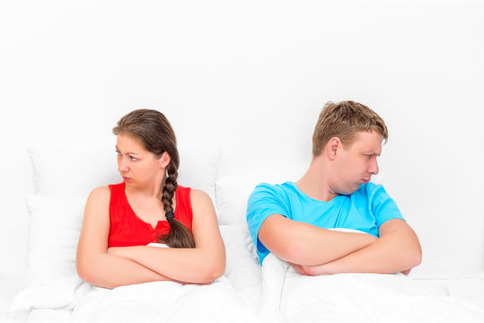 conflict situation of a young couple in bed