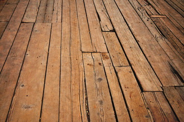 Vintage wooden surface with planks and gaps in perspective