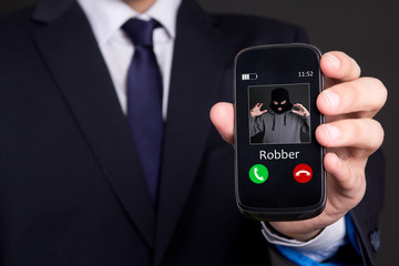 phone robbery concept - hand holding smart phone with incoming c