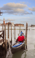 Fototapeta na wymiar Gondola at the Dock at Sunset, Venice, Italy