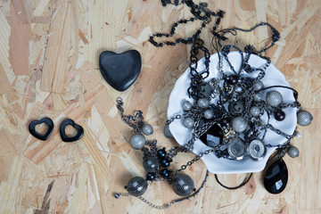 Pile of assorted black chains with shiny box chains,