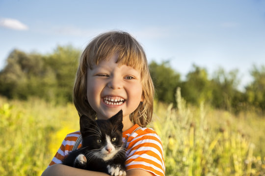 Happy kid with a kitten