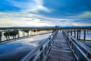 Wooden bridge cross around marsh in sunset time at Sam Roi Yot National Park,Thailand