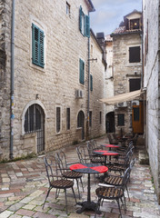 Fototapeta na wymiar Outdoor Resturant Tables After the Rain Kotor, Montenegro